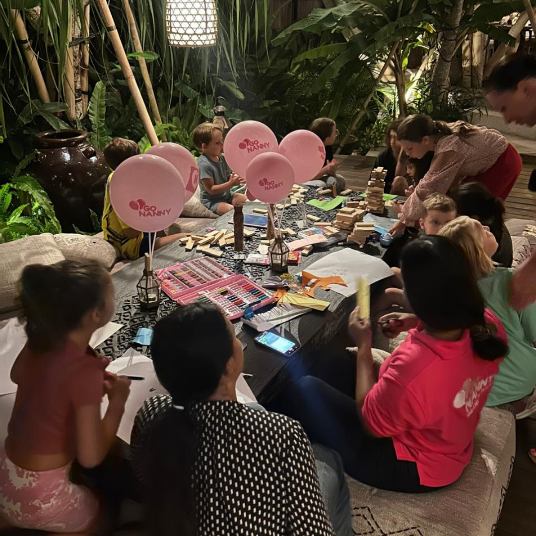 Children playing with nanny